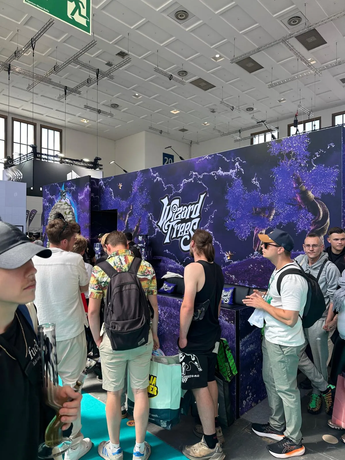 Wizard Trees booth with purple branding and visitors at Mary Jane Berlin 2026